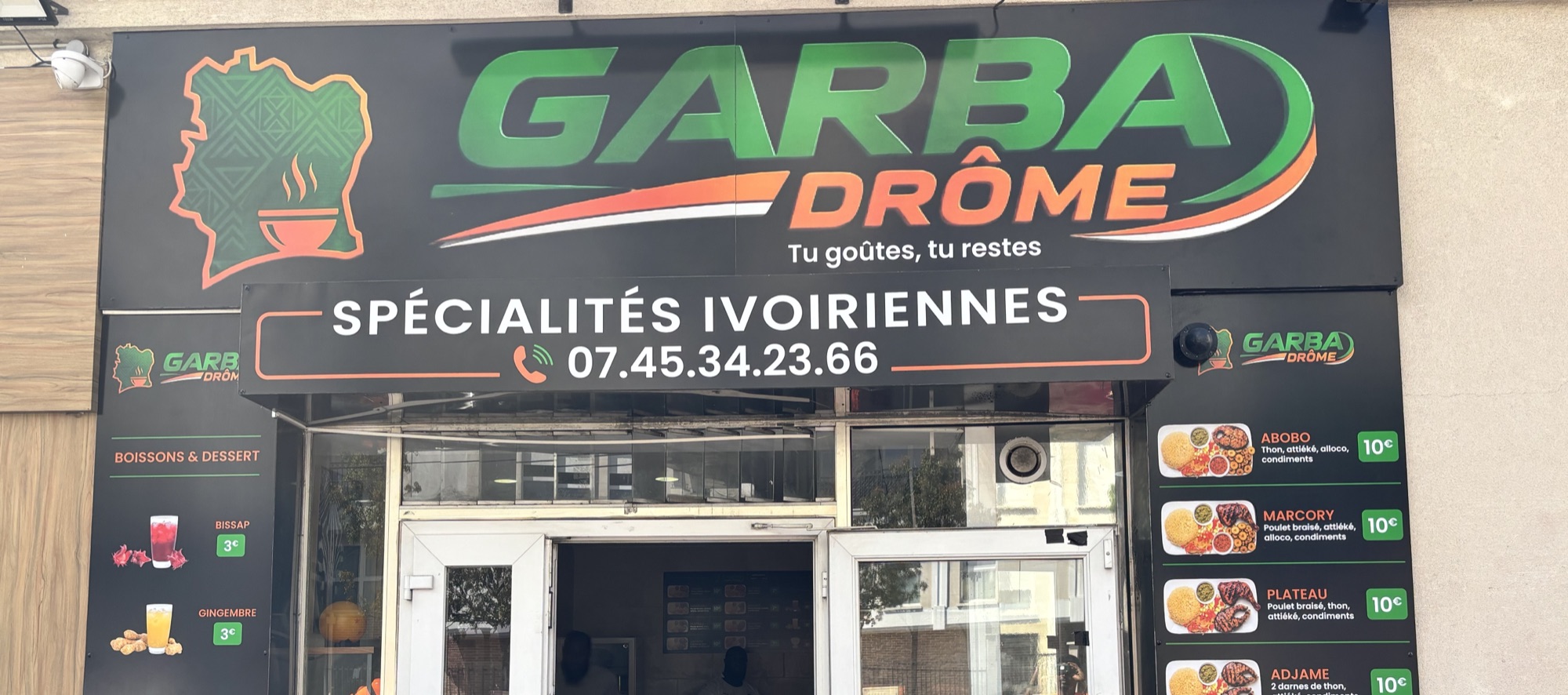 L'enseigne verte et orange du Garbadrome vue depuis la rue Parmentier à Gagny
